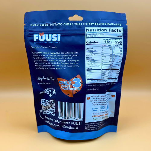 Blue package of FUUSI sweet potato chips with nutrition facts and branding details on a beige background